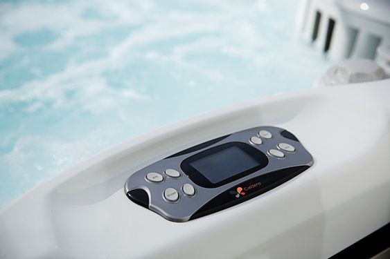 An image of the utopia hot tub wireless remote control that is close to the seating